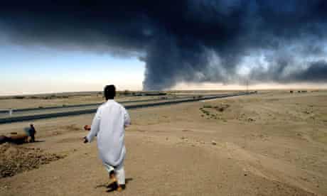 Iraq war stories: A huge cloud of smoke rises up from a blaze on Iraq's oil export pipeline.