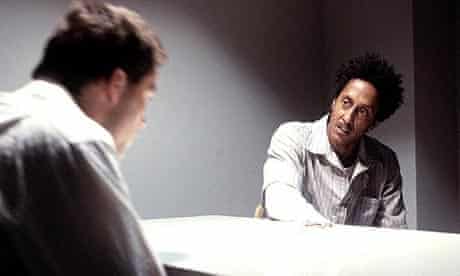 Dominic West as McNulty and Andre Royo as Bubbles in The Wire