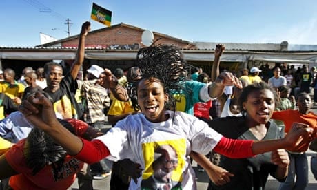 A supporter of the ANC leader celebrates in Guguletu, Cape Town