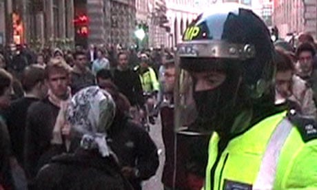 A masked police officer at the G20 protest in London