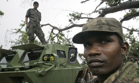 Sri Lankan army soldiers stand guard in Mullaittivu