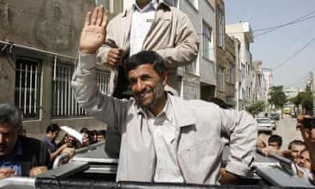 Iran's President Mahmoud Ahmadinejad, greets his supporters after voting in the elections in Tehran