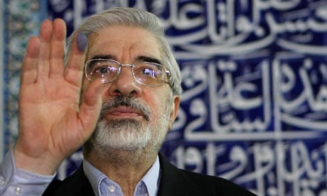 Former Iranian prime minister and presidential candidate, Mir Hossein Mousavi waves after voting