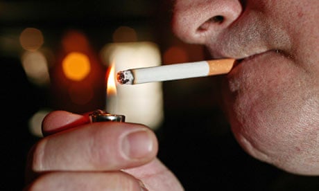 A smoker lighting a cigarette