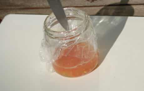 Poking some holes in the top of the shrink wrapped jar