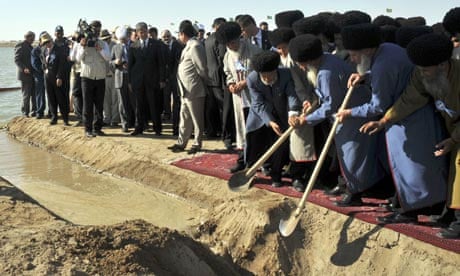 Turkmen elders open a drain channel to start filling the country's Golden Age Lake.