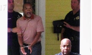 In this photo taken by a neighbor on 16 July 2009, Henry Louis Gates Jris arrested at his home