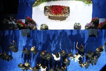Casket and mourners