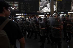G8 preparations: Riot policemen enter Termini station after protesters invaded the tracks