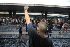 G8 preparations: Protesters block the tracks at Termini railway station in Rome, Italy
