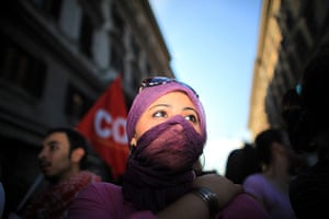G8 preparations: Masked anti-G8 protesters take to the streets near Piazza Barberini in Rome