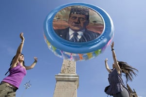 G8 preparations: ActionAid activists throw a pool with Berlusconi's face into the air