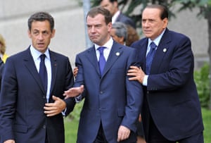 G8 summit update: Silvio Berlusconi shares a word with Nicolas Sarkozy and Dmitry Medvedev