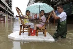 Typhoon Marakot: Cangnan county: A resident pulls a makeshift raft