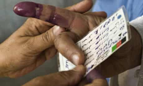 An Afghan woman's ink-dipped finger after showing her identity card to vote