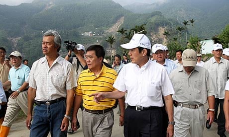 Taiwanese president Ma Ying-jeou (in white cap) visiting Taiho, a village hit by typhoon Morakot.