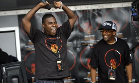 Comedian Tracy Morgan, left, dances as filmmaker Spike Lee looks on during Michael Jackson day 