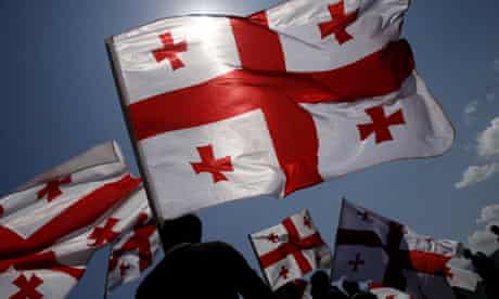 Georgians wave their national flag