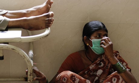 Woman wearing mask to protect against swine flu, India