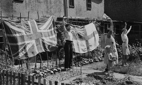 A family displays an English and a British flag in their back garden during the second world war.