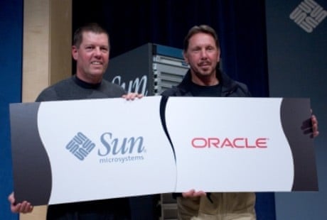 Scott McNealy and Larry Ellison with logos