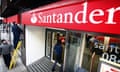 Workers remove the old Abbey National Plc logo and unveil the new Santander branding.