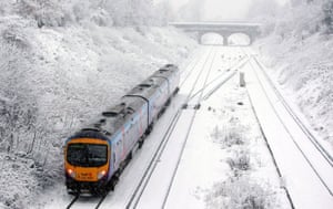Snow: Train near Hunts Cross station in Liverpool