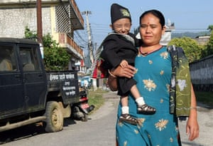 Khagendra Thapa Magar: Khagendra Thapa Magar is carried by his mother Dhana Maya Thapa