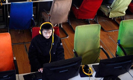 A customer uses computer in an internet cafe at Changzhi