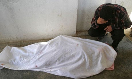 An Iraqi man cries over the body of his daughter Suad Abdullah, 14, in Falluja in April 2004