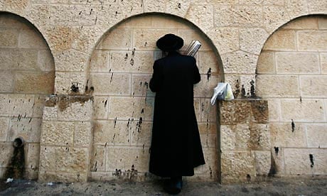 An ultra-Orthodox Jewish man prays outside Rachel's Tomb, known as Bilal bin Rabah mosque to Muslims