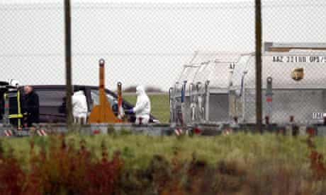 Security officials at East Midlands airport after an explosive package was found on a cargo plane