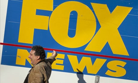 Man gestures at Fox News van