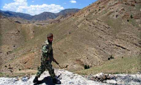 A Pakistani soldier patrols the border with Afghanistan in North Waziristan