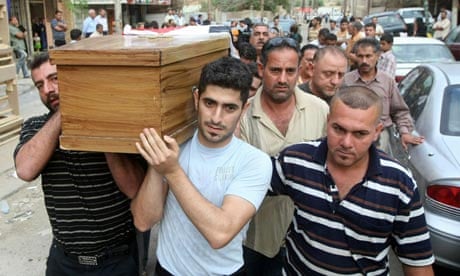 Iraqi Christians carry the coffin of a relative killed in baghdad church