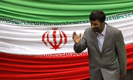 Mahmoud Ahmadinejad leaves the podium after being sworn back in as Iranian president