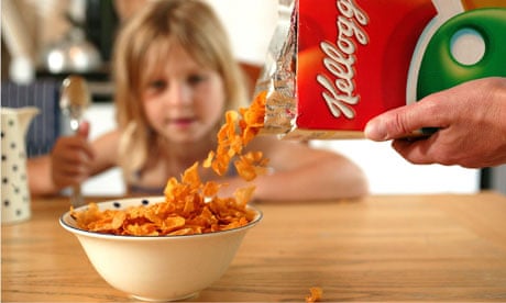 A child eating Kelloggs cornflakes