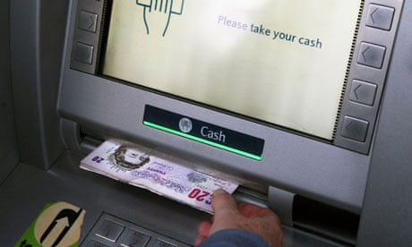 Money being withdrawn from a cash machine (ATM)