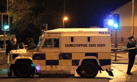 A police Land Rover blocks the Belfast road where a bomb thrown at police left one needing surgery
