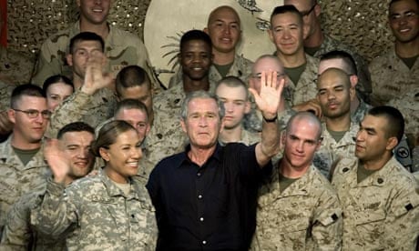 George Bush, pictured here with US marines in Anbar province, Iraq