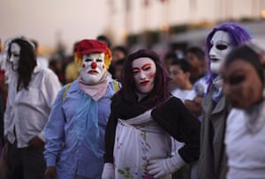 Guadalupe festival : Artists, wearing masks, look on as they performs 