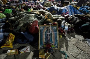 Guadalupe festival : Mexican pilgrims sleep next to an image of Our Lady of Guadalupe