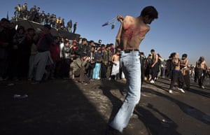 Ashura Religious Festival: Shi'ite Muslim man flagellates a Muharram procession during Ashura in Kabul