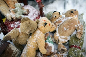 Winter weather: Teddy bears lay on the snow covered ground at Newark Antique Fair 
