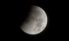 A total lunar eclipse beginning as the full moon is shadowed by the Earth