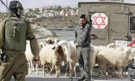 A Palestinian shepherd at an Israeli checkpoint in the village of Maasarah, near Bethlehem