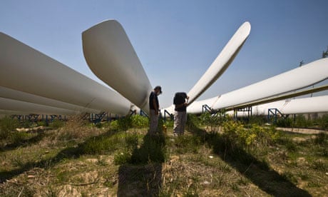 Workers in China painting wind turbine blades