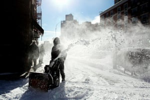 East coast blizzards: A man clears snow in Manhattan's Harlem in New York City