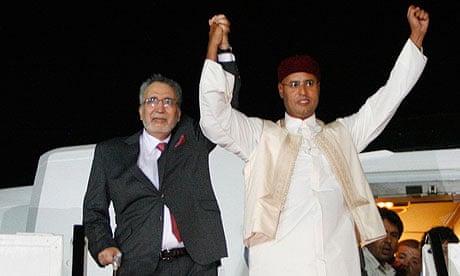 Convicted Lockerbie bomber, Abdel Baset al-Megrahi, with Seif al-Islam Gaddafi on arrival in Libya