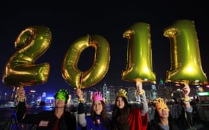 New Years Celebrations: Hong Kong, China: Revellers pose for pictures during the countdown
